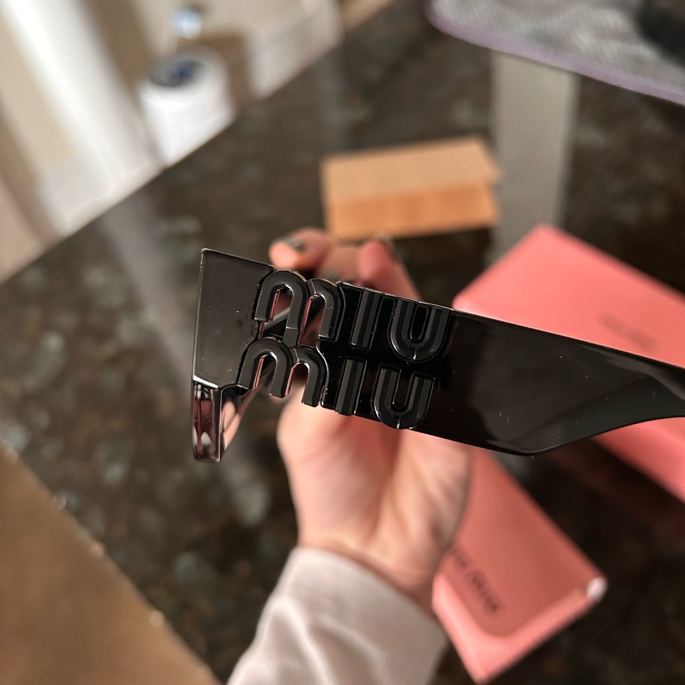 Miu Miu Sleek Black Sunglasses